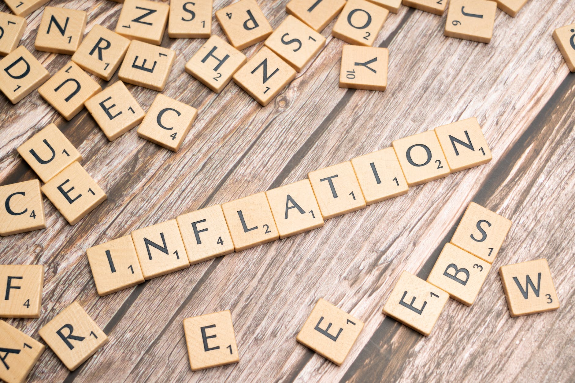 the word inflation is spelled out in scrabble letters